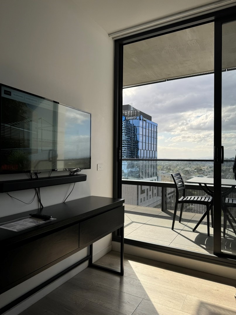 looking out onto the balcony from inside the suite shows that a step is required to access the space