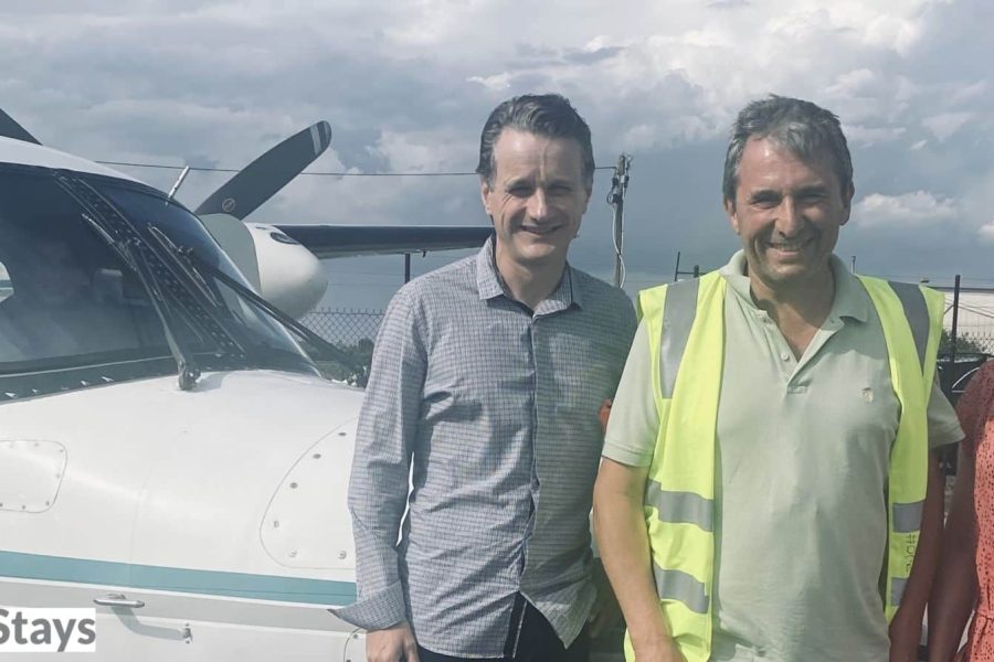 Team members from Angel Flight Australia and MediStays stand in front of an Angel Flight plane.