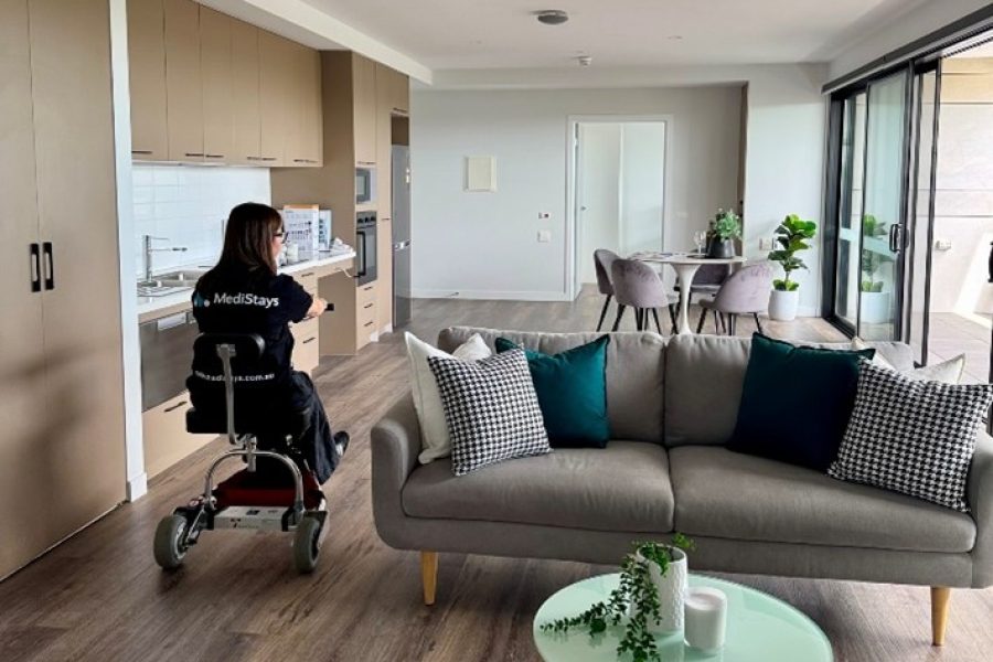 Ash in wheelchair in a living room