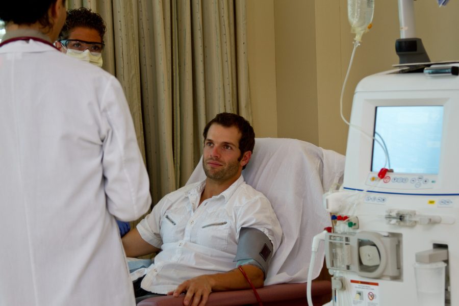 Image of country patient sitting in nephrology department at hospital to receive kidney dialysis.